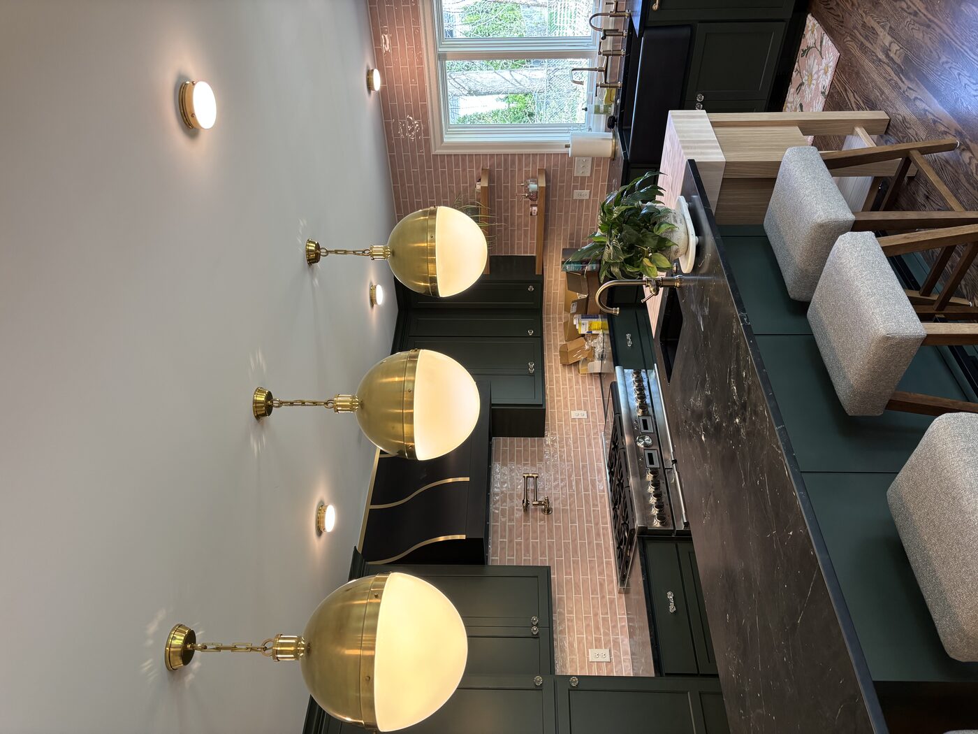 Brass pendant lighting over kitchen island